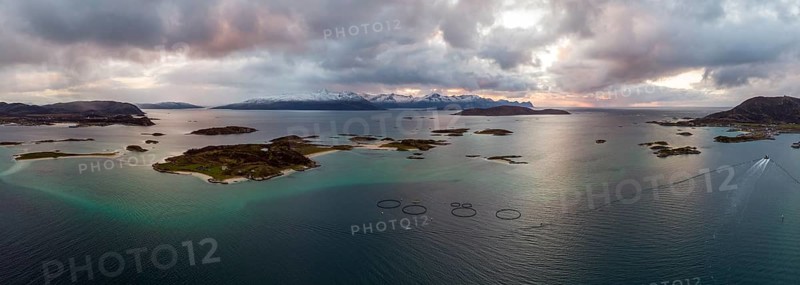 View over the sea with fish farms to Baltsfjorden and the mountains of Balten