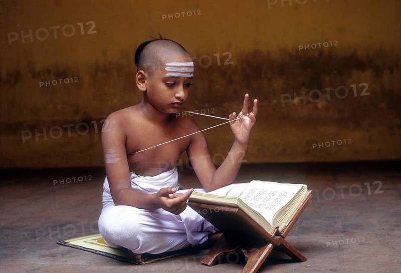 Indian boy reciting vedas