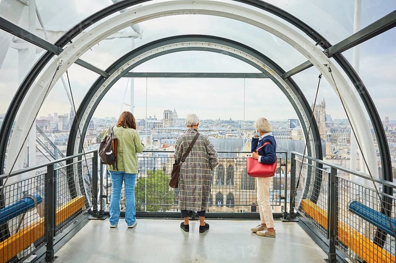 Visitors to the Centre Pompidou in the tubular corridors of the cultural centre overlook the metropolis Centre Georges Pompidou
