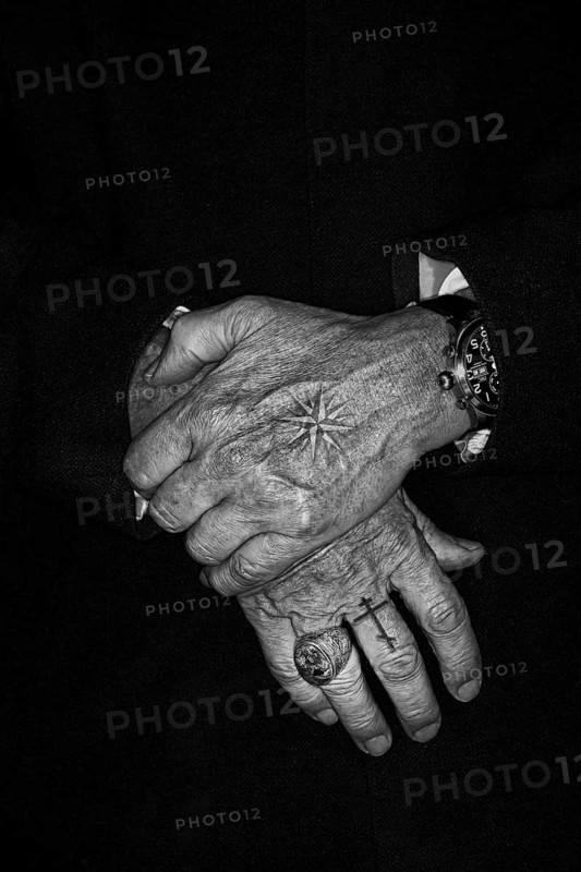 Men's hands with Russian Mafia tattoos