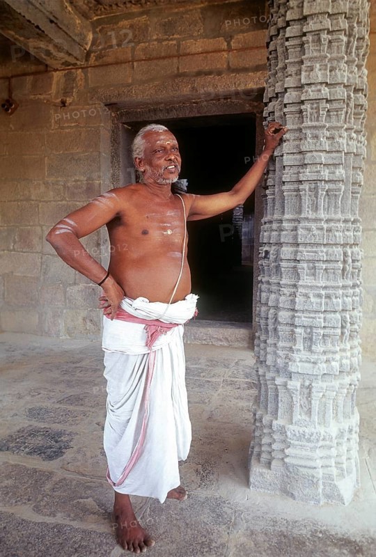 Temple priest standing Kampaheswarar temple in Thirubuvanam near Kumbakonam