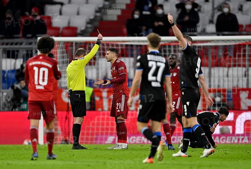 Referee Marco Fritz shows Lucas Hernandez FC Bayern Munich FCB 21 yellow card
