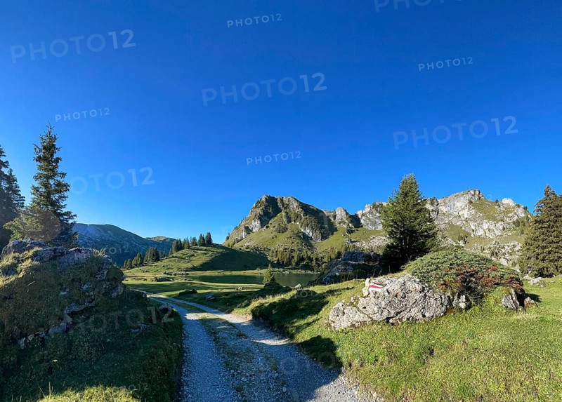 Hiking trail marking on a stone at Seebergsee