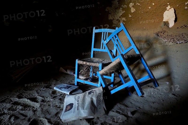 Two blue chairs with wickerwork in cave