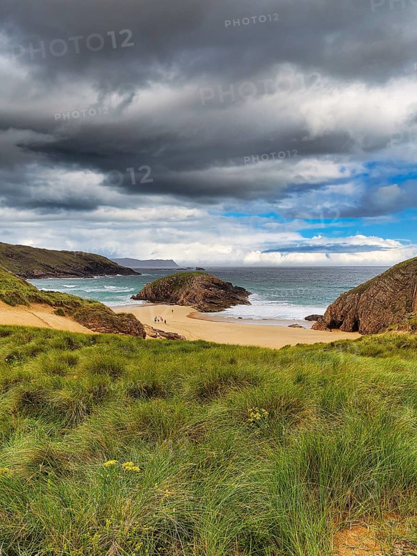 View of rocky coast with sandy beach