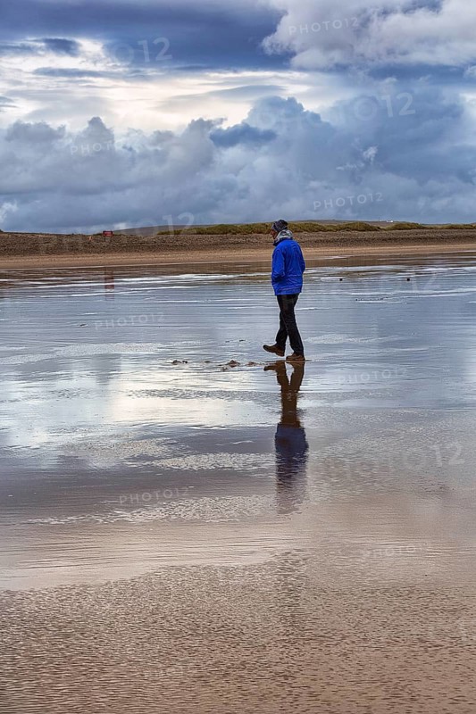 Walkers on the beach