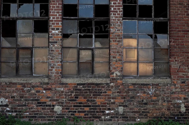 Brick house with factory fesnter of workshop at railway station