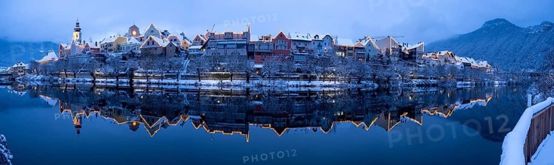 House facade of Frohnleiten reflected in the river Mur