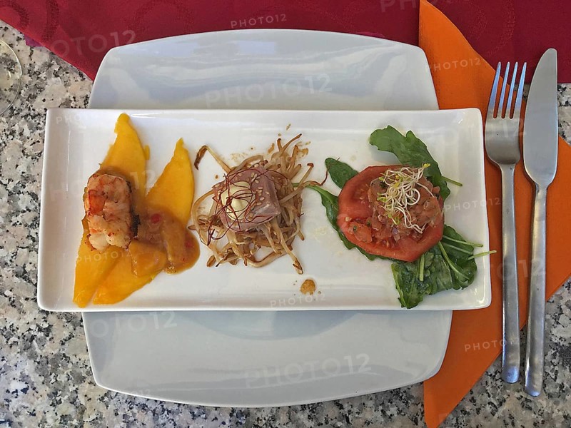Tapa plate with mango slices