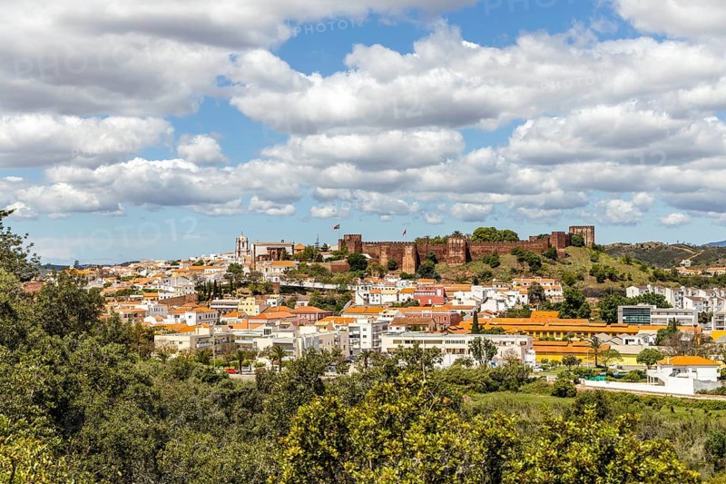 Silves cityscape with Moorish castle and cathedral on the top of the hill
