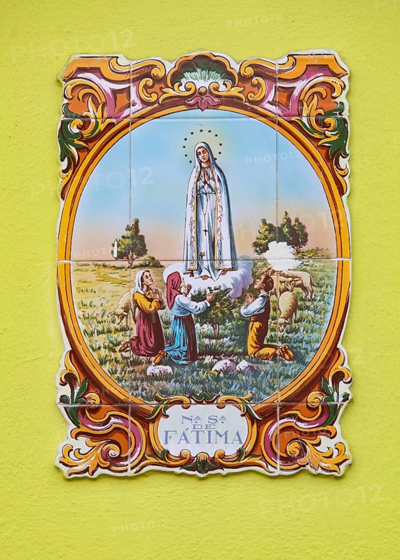 Typical Portuguese tile painting with saint motifs at the house entrances