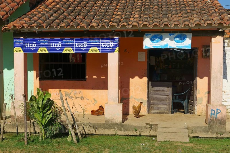 Small shop with chickens on the veranda