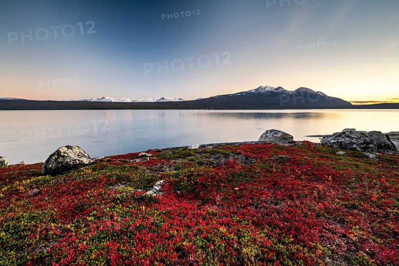 Autumnal fell landscape with lake Akkajaure and mountain range Akka