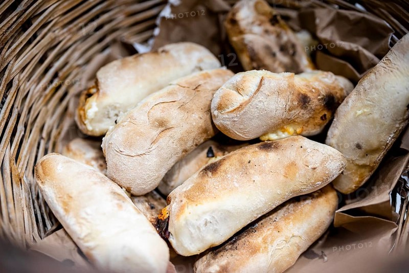 Traditional bread rolls with cheese and chorico meat baked in wood-fired oven
