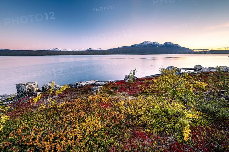 Autumnal fell landscape with lake Akkajaure and mountain range Akka