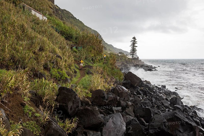 Hikers on the path along the coast to Rocha da Relva