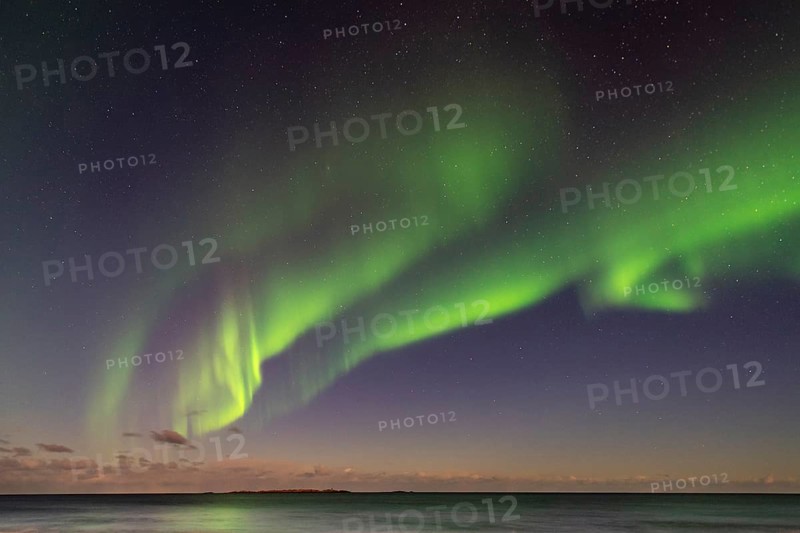 Aurora borealis in winter Scandinavian landscape