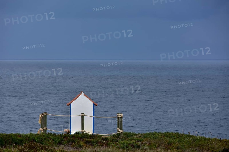 White shrine to seafarers by the sea