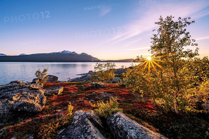 Autumnal fell landscape with lake Akkajaure and mountain range Akka