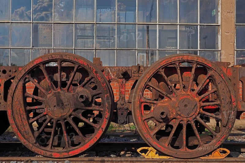 Railway wheels in front of factory hall