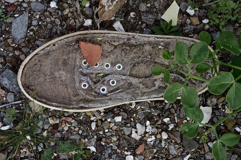 Light linen shoe with leaves on the bottom from above