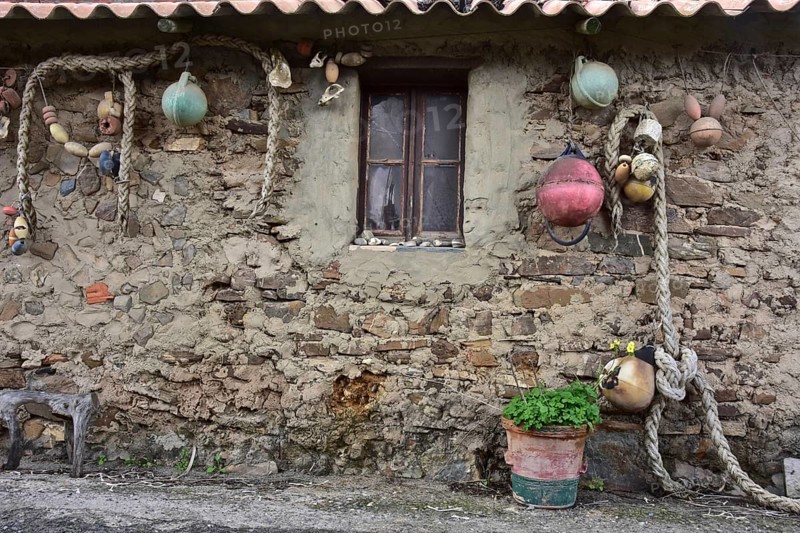 Ropes and buoys as decoration on the wall of a fishing house