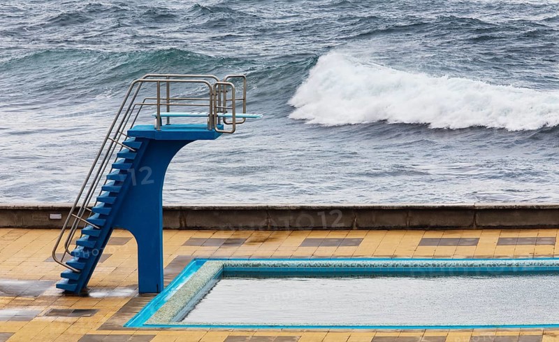 Swimming pool with diving tower on the Atlantic coast