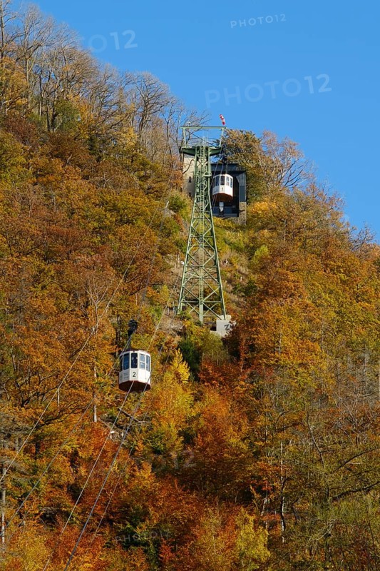 Cable car up the large castle hill in autumn