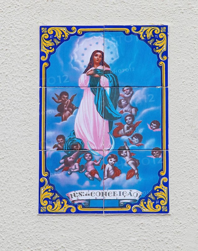 Typical Portuguese tile painting with saint motifs at the house entrances