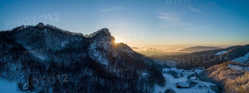 Sunrise at the Frohburg castle ruins and Geissflue summit cross