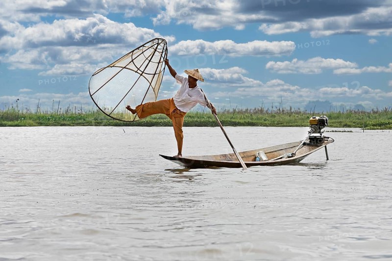 Fisherman at Inle Lake with traditional Intha conical net