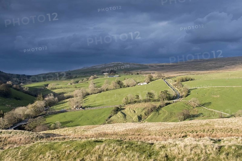 Storm clouds gathering over farmland near Ravenstonedale
