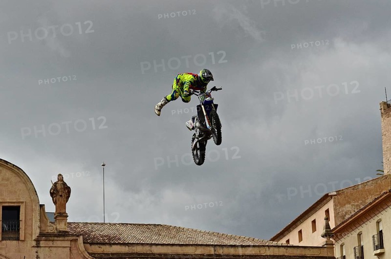 Flying motorbike artist above the rooftops of the old town