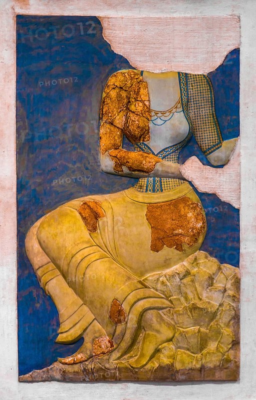 Fragments of a painted plaster relief of a richly dressed female figure