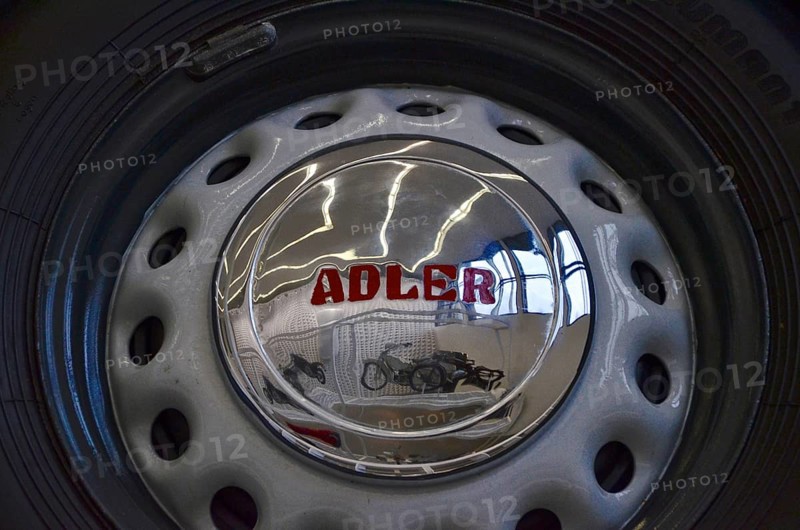 Reflection of motorbike in hubcap of car in Museum Neue Sammlung