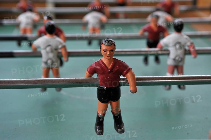 Figures on poles from table football