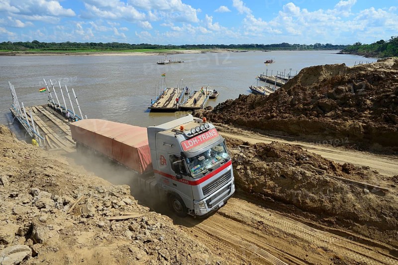Truck driving off the ferry across the Rio Mamore