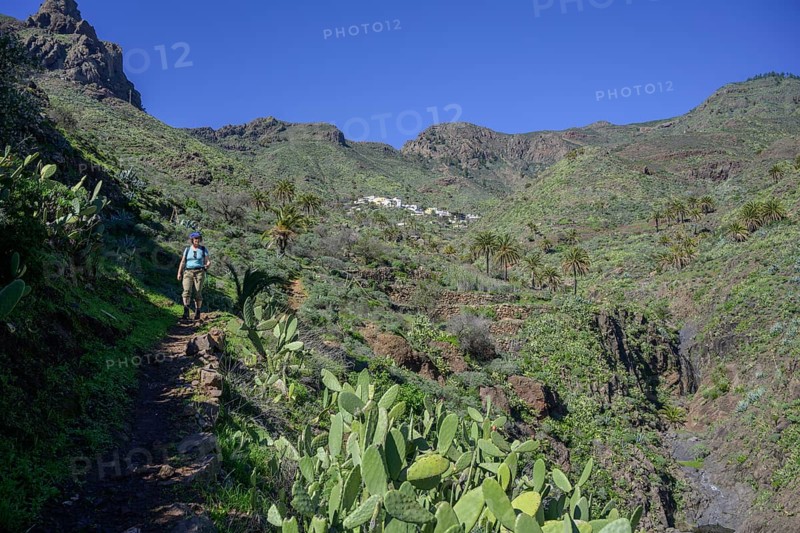 Hiker on hiking trail Barranco Guarimar in the background Place Imada