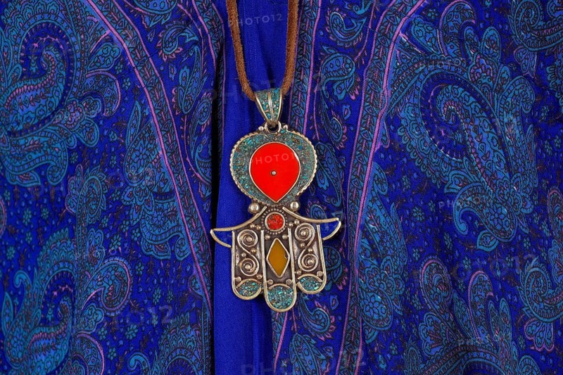 Indian jewellery as pendant on leather strap