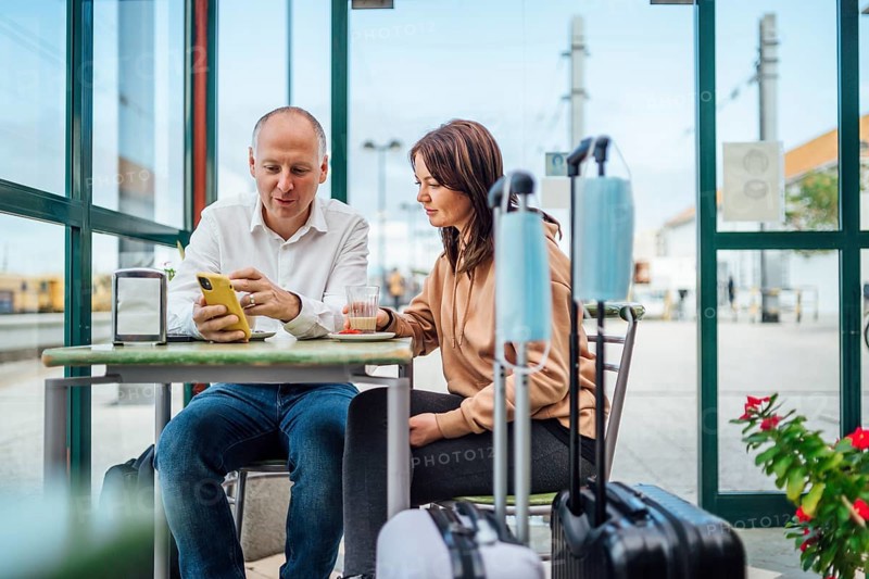 A couple of travelers drinking coffee