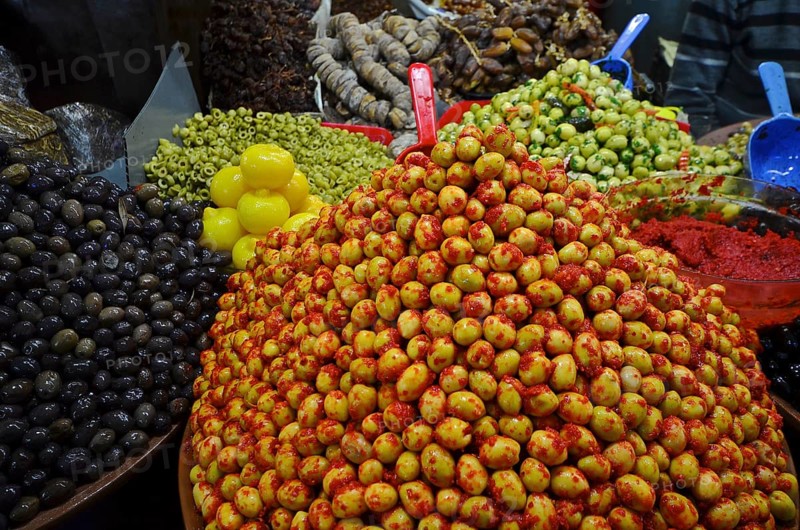 Moroccan salted lemons on mountain with varieties of olives