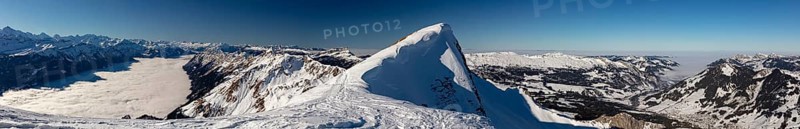 Mountain panorama with high fog over Lake Brienz