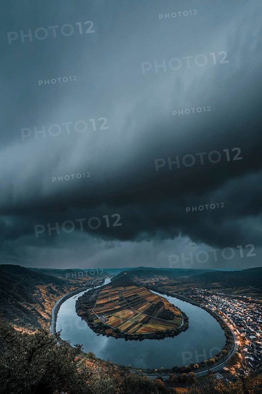 View over the Moselle near Bremm to the thunderstorm and in autumn