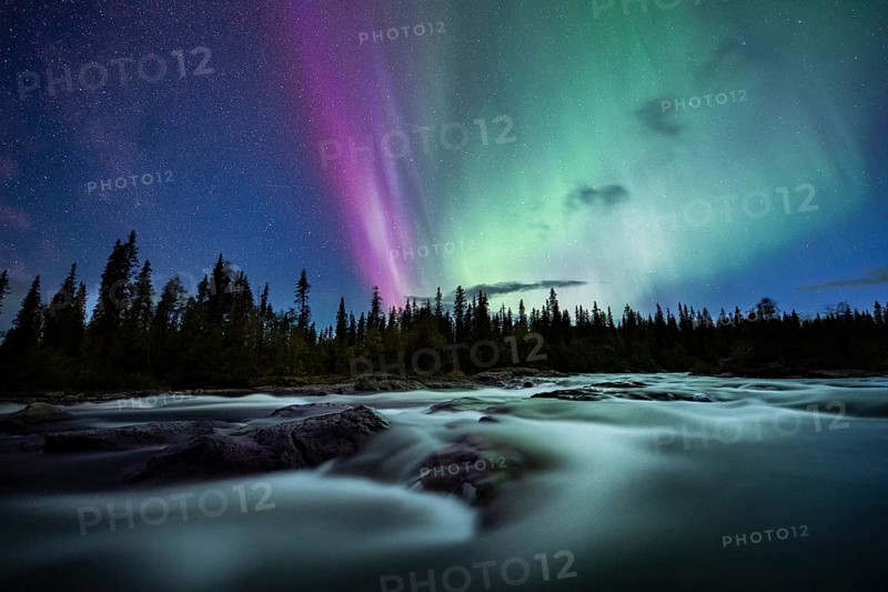 Northern Lights or Aurora Borealis over River Gamajahka or Kamajakka
