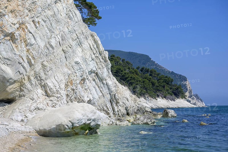 High rocks at the end of the beach Spiaggia del Frate