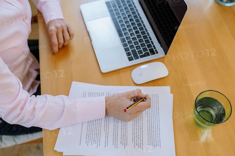 Woman proofreading at her desk