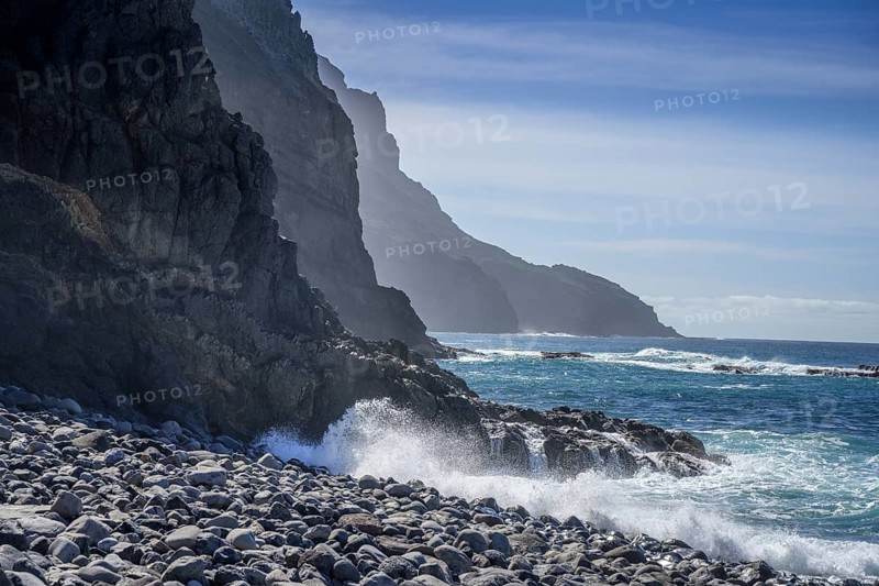 The beach framed by rocks at Playa del Trigo