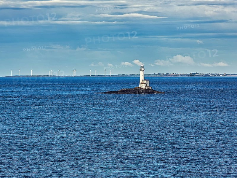 Tuskar Rock Lighthouse on small rocky island