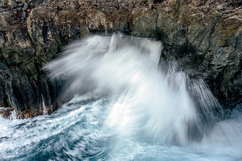 Surf at rocky lava coast