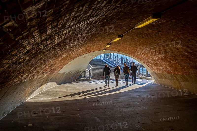 Passers-by cross a subway at the Schlossbruecke in Berlin-Mitte
